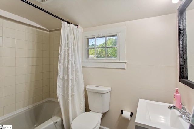 full bathroom featuring shower / bath combo, toilet, and vanity