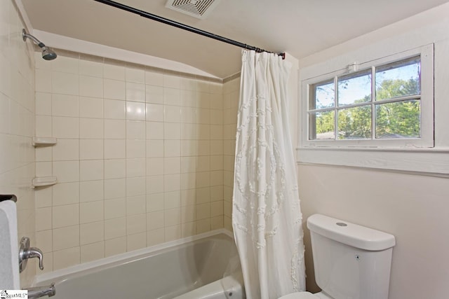 full bathroom with shower / bath combination with curtain, toilet, and visible vents