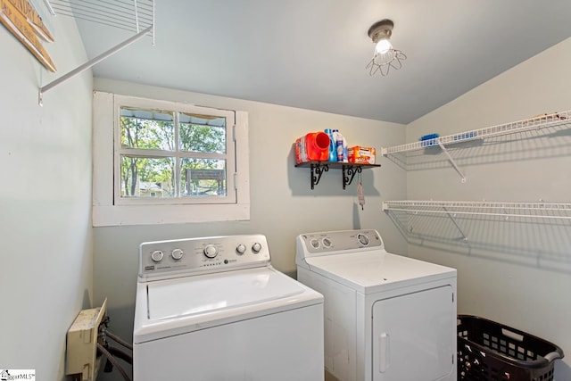 washroom with separate washer and dryer and laundry area