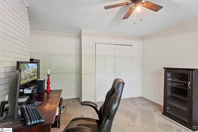 home office with baseboards, carpet, ceiling fan, and crown molding