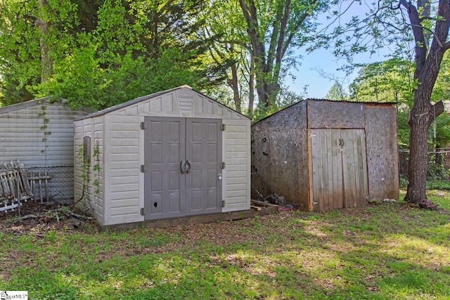 view of shed with fence