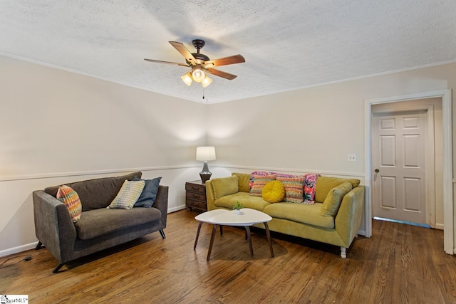 living room featuring a ceiling fan, wood finished floors, and a textured ceiling