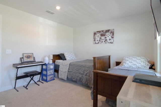 carpeted bedroom with visible vents