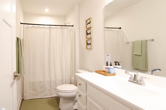 full bath featuring toilet, vanity, and a shower with shower curtain