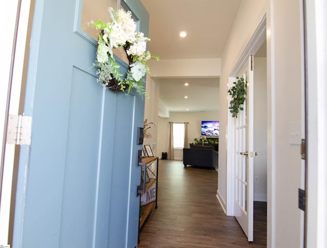 corridor with french doors, recessed lighting, and dark wood-style flooring