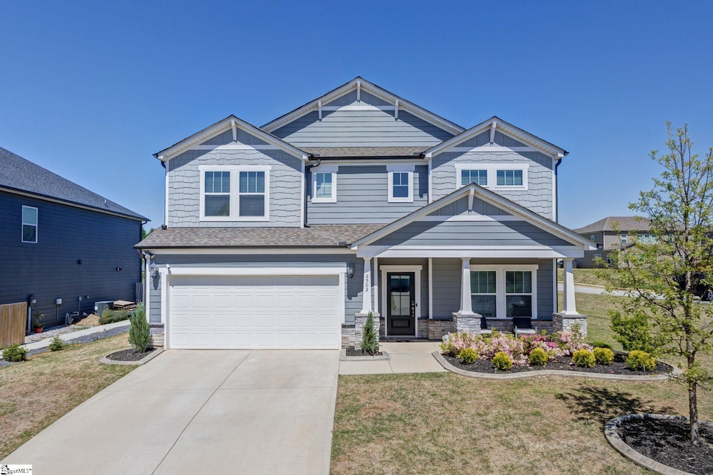 2502 Apsley Ct, Greer, SC 29651 - craftsman-style home with an attached garage, a front lawn, covered porch, and driveway