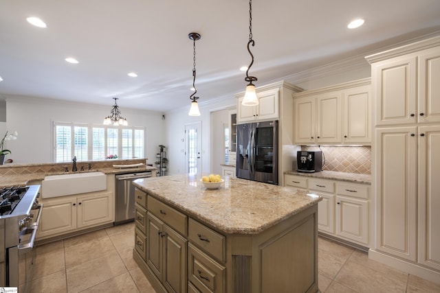 kitchen featuring stainless steel dishwasher, a sink, fridge with ice dispenser, decorative backsplash, and cream cabinetry