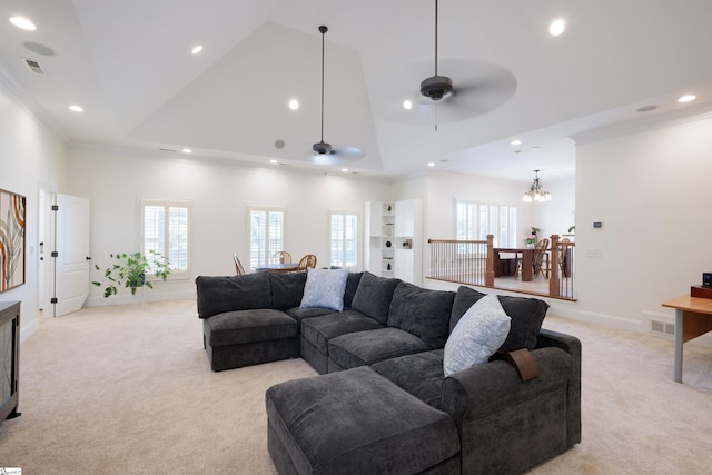 living room featuring light carpet, a wealth of natural light, recessed lighting, and ornamental molding
