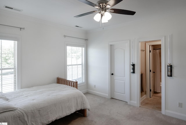 bedroom featuring visible vents, ornamental molding, and light carpet