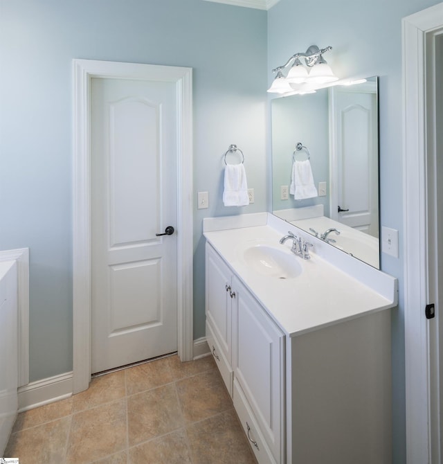 bathroom with vanity and baseboards