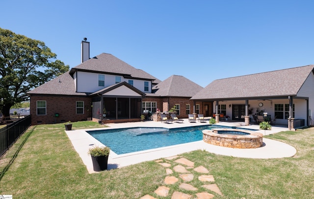 view of swimming pool featuring a fenced backyard, a patio area, ceiling fan, a yard, and a sunroom