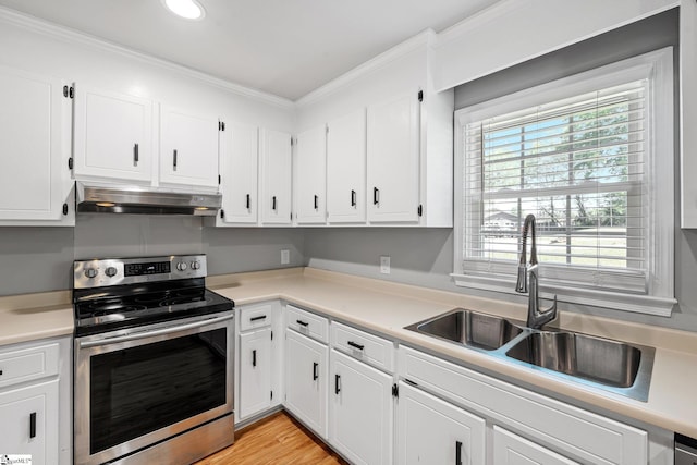 kitchen with electric stove, white cabinetry, under cabinet range hood, and a sink