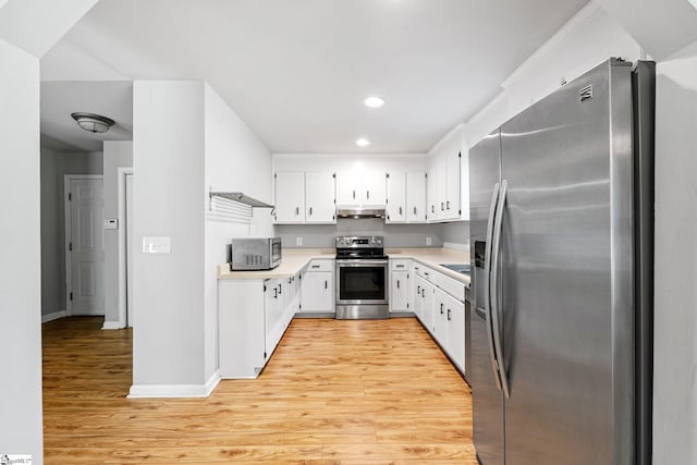 kitchen with stainless steel appliances, light wood-type flooring, recessed lighting, light countertops, and under cabinet range hood