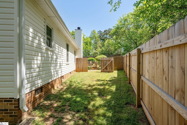 view of yard featuring a fenced backyard