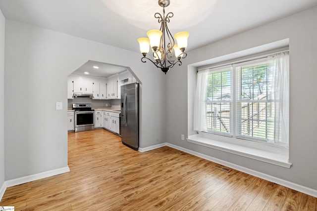 unfurnished dining area with light wood-style flooring, baseboards, visible vents, recessed lighting, and a chandelier