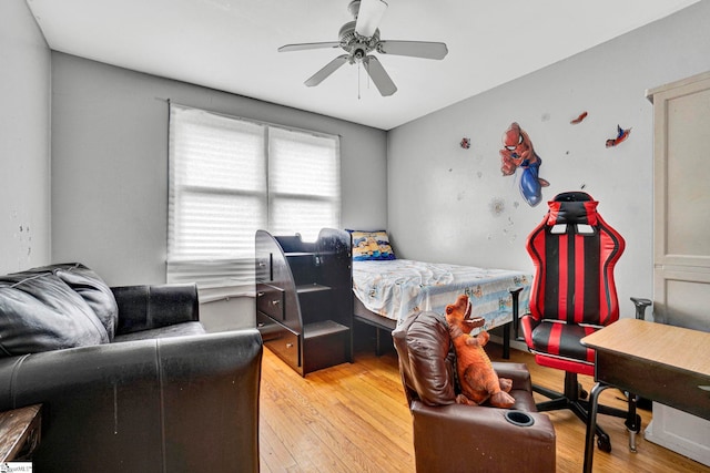 bedroom with light wood-type flooring and a ceiling fan