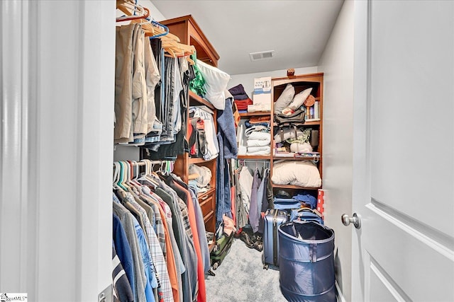 spacious closet with carpet floors and visible vents