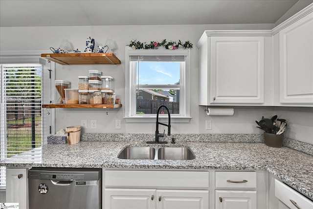 kitchen with white cabinets, dishwasher, open shelves, and a sink
