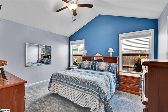 carpeted bedroom featuring lofted ceiling, baseboards, visible vents, and ceiling fan