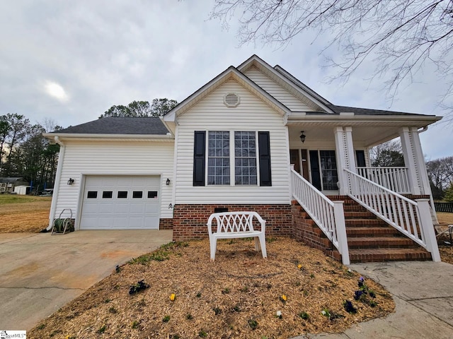 949 Jones Mill Rd, Fountain Inn, SC 29644 - view of front facade featuring an attached garage, a porch, stairs, and driveway