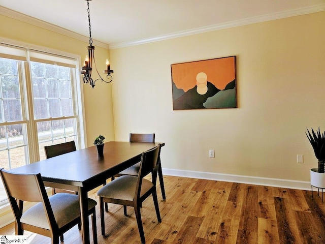 949 Jones Mill Rd, Fountain Inn, SC 29644 - dining space with ornamental molding, an inviting chandelier, light wood-style flooring, and baseboards