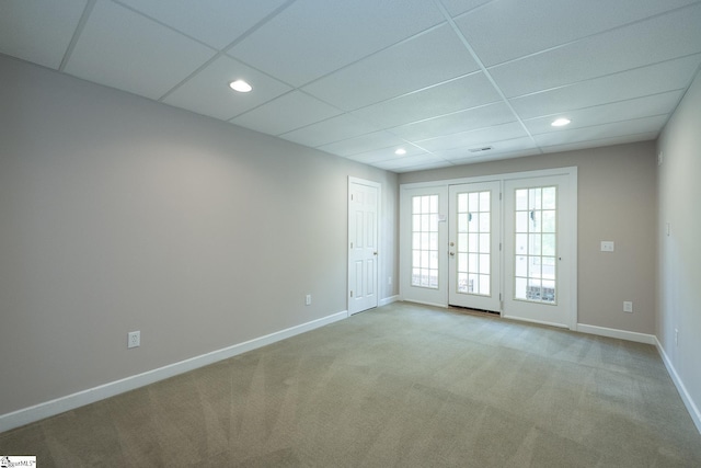 unfurnished room with recessed lighting, baseboards, and light carpet