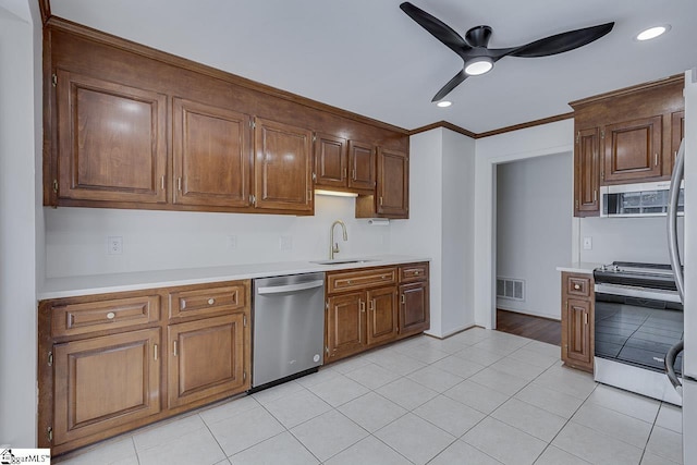 kitchen featuring a sink, ceiling fan, light countertops, appliances with stainless steel finishes, and visible vents