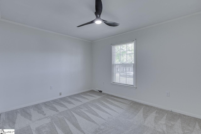 carpeted empty room with baseboards and ornamental molding