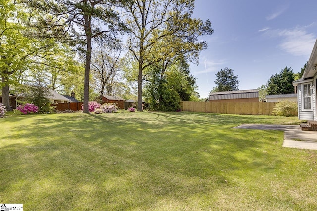 view of yard featuring a patio area and fence private yard