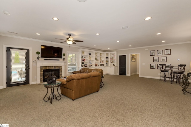 living area featuring carpet floors, recessed lighting, baseboards, ceiling fan, and crown molding