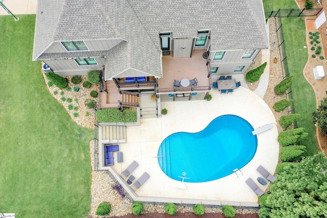 view of subject property with a pool