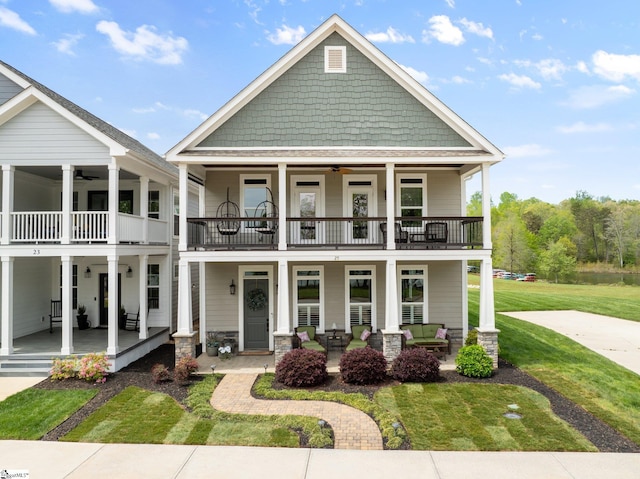 25 Waterside Ln, Taylors, SC 29687 - view of front of property with covered porch, a ceiling fan, a balcony, and a front yard