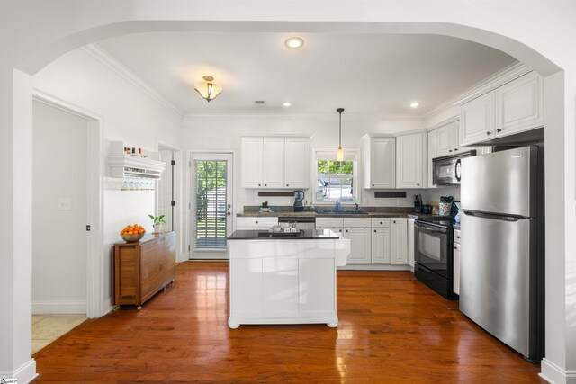 504 Anderson St, Greenville, SC 29601 - kitchen with black appliances, arched walkways, dark countertops, and a sink