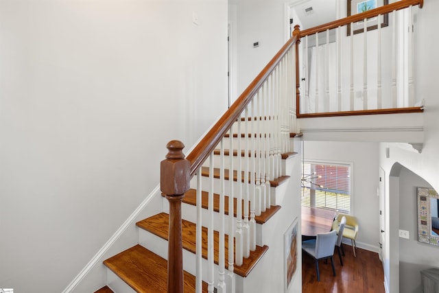 504 Anderson St, Greenville, SC 29601 - stairway featuring visible vents, baseboards, wood finished floors, and arched walkways
