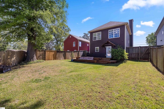 504 Anderson St, Greenville, SC 29601 - back of house featuring a wooden deck, a lawn, a chimney, and a fenced backyard
