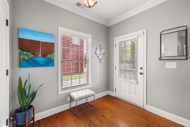 504 Anderson St, Greenville, SC 29601 - entrance foyer featuring wood finished floors, visible vents, crown molding, and baseboards