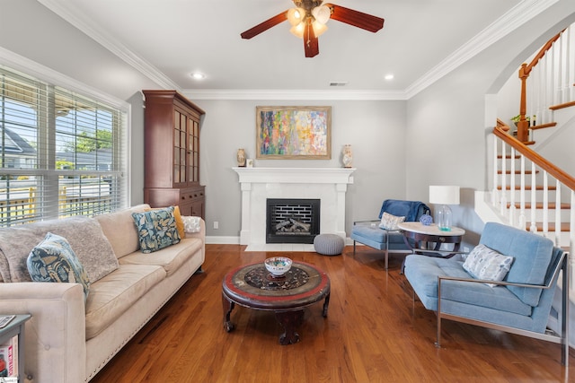 504 Anderson St, Greenville, SC 29601 - living area with a fireplace with flush hearth, visible vents, a ceiling fan, crown molding, and stairs