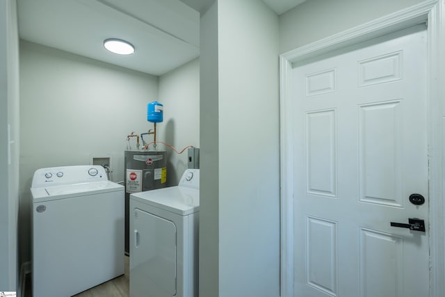 laundry room featuring washing machine and dryer and laundry area