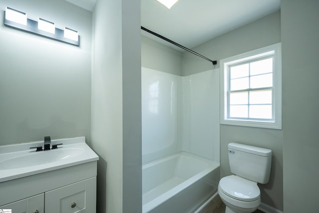 full bathroom featuring toilet, vanity, and  shower combination