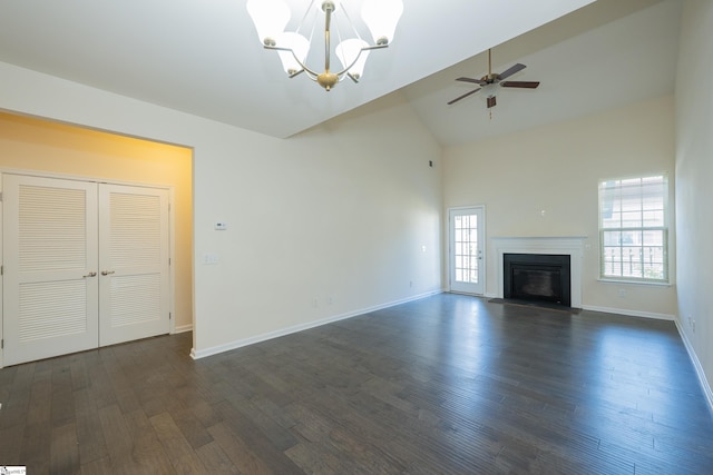 unfurnished living room with high vaulted ceiling, a glass covered fireplace, dark wood-type flooring, and ceiling fan with notable chandelier