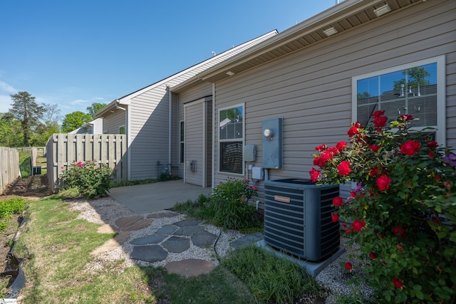 back of house with fence, a patio, and central AC unit