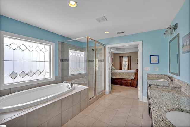 ensuite bathroom with a shower stall, a sink, connected bathroom, a wealth of natural light, and visible vents