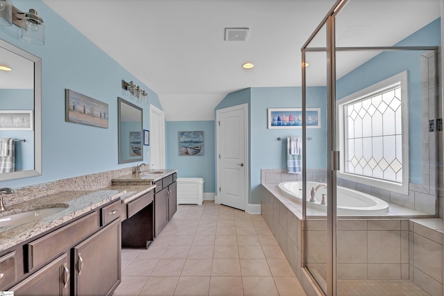 full bathroom with tile patterned flooring, a garden tub, a sink, and double vanity
