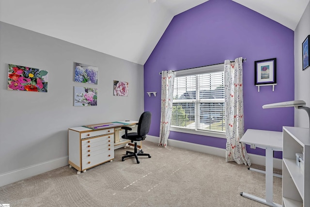office space featuring vaulted ceiling, carpet flooring, and baseboards