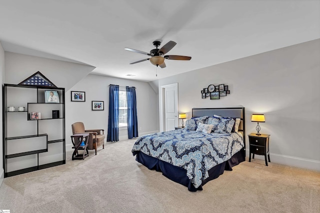 carpeted bedroom featuring ceiling fan and baseboards
