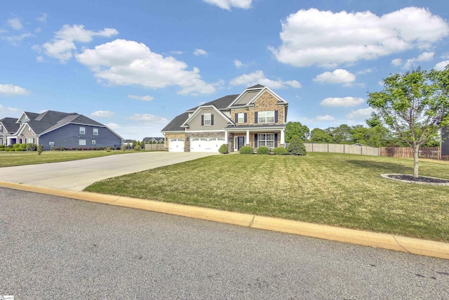 view of front of property with driveway, a porch, fence, an attached garage, and a front yard