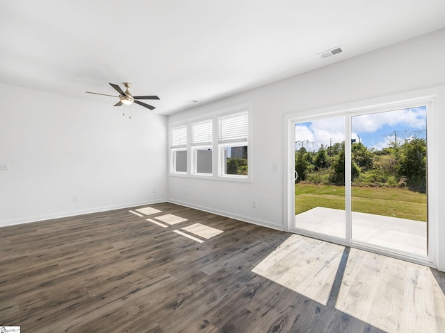 1415 Darrowby Way, Spartanburg, SC 29301 - unfurnished living room with ceiling fan, baseboards, visible vents, and dark wood-style floors