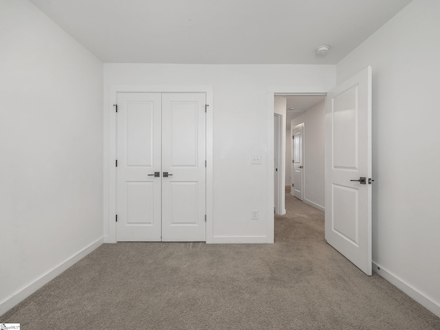 1415 Darrowby Way, Spartanburg, SC 29301 - unfurnished bedroom featuring light colored carpet, baseboards, and a closet