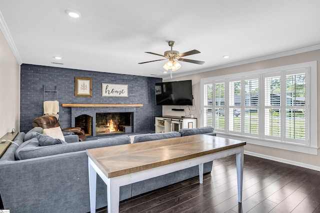 204 Thackston St, Fountain Inn, SC 29644 - living room with a ceiling fan, a large fireplace, dark wood-type flooring, and ornamental molding