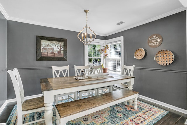 204 Thackston St, Fountain Inn, SC 29644 - dining space featuring a notable chandelier, wood finished floors, baseboards, ornamental molding, and visible vents